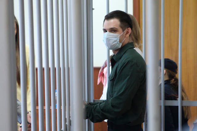 <p>US Marine veteran Trevor Reed stands behind bars in a courtroom in Moscow, Russia, on Monday, July 20, 2020 </p>