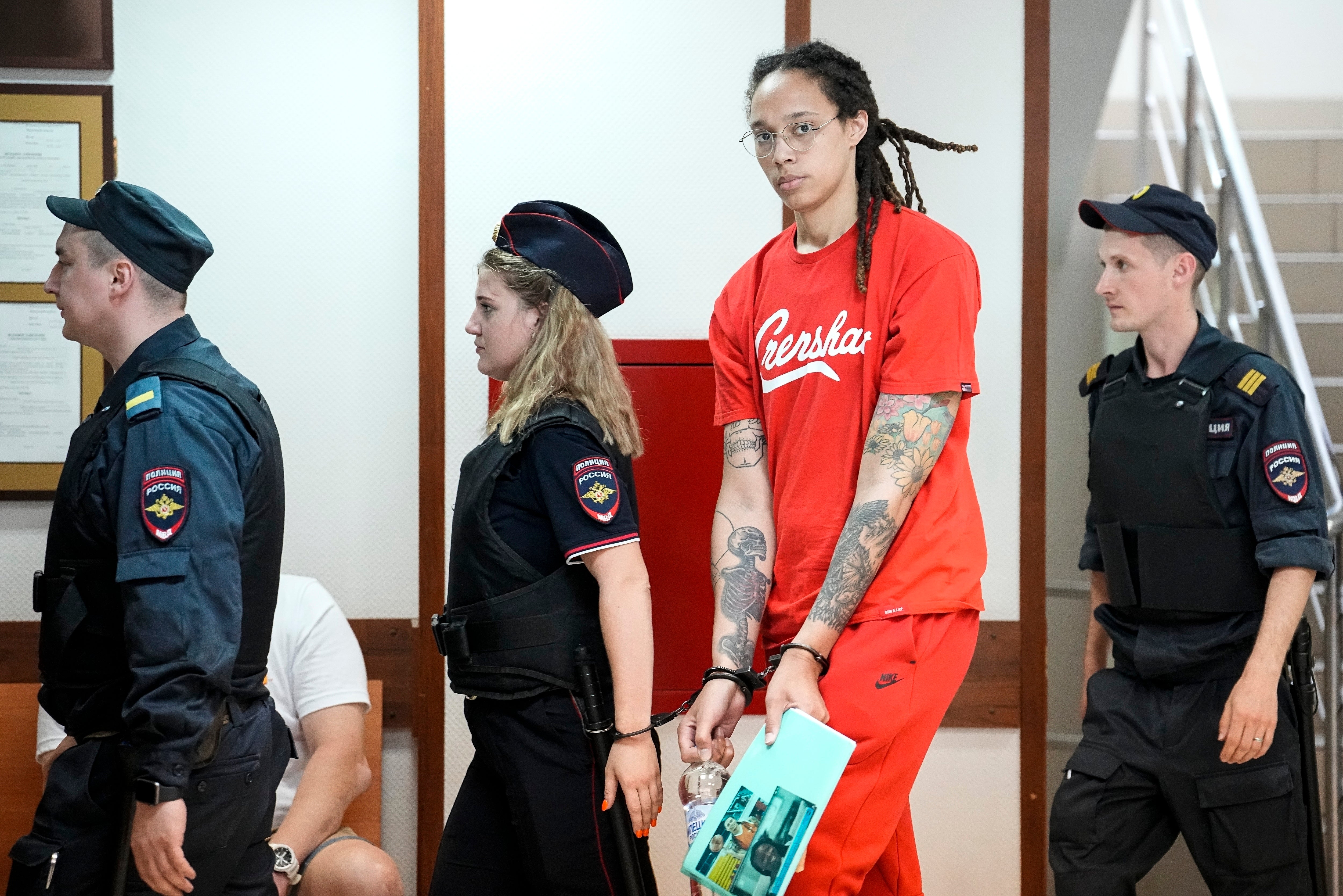 WNBA star and two-time Olympic gold medalist Brittney Griner is escorted to a courtroom for a hearing in Khimki outside Moscow, Russia on 7 July 2022