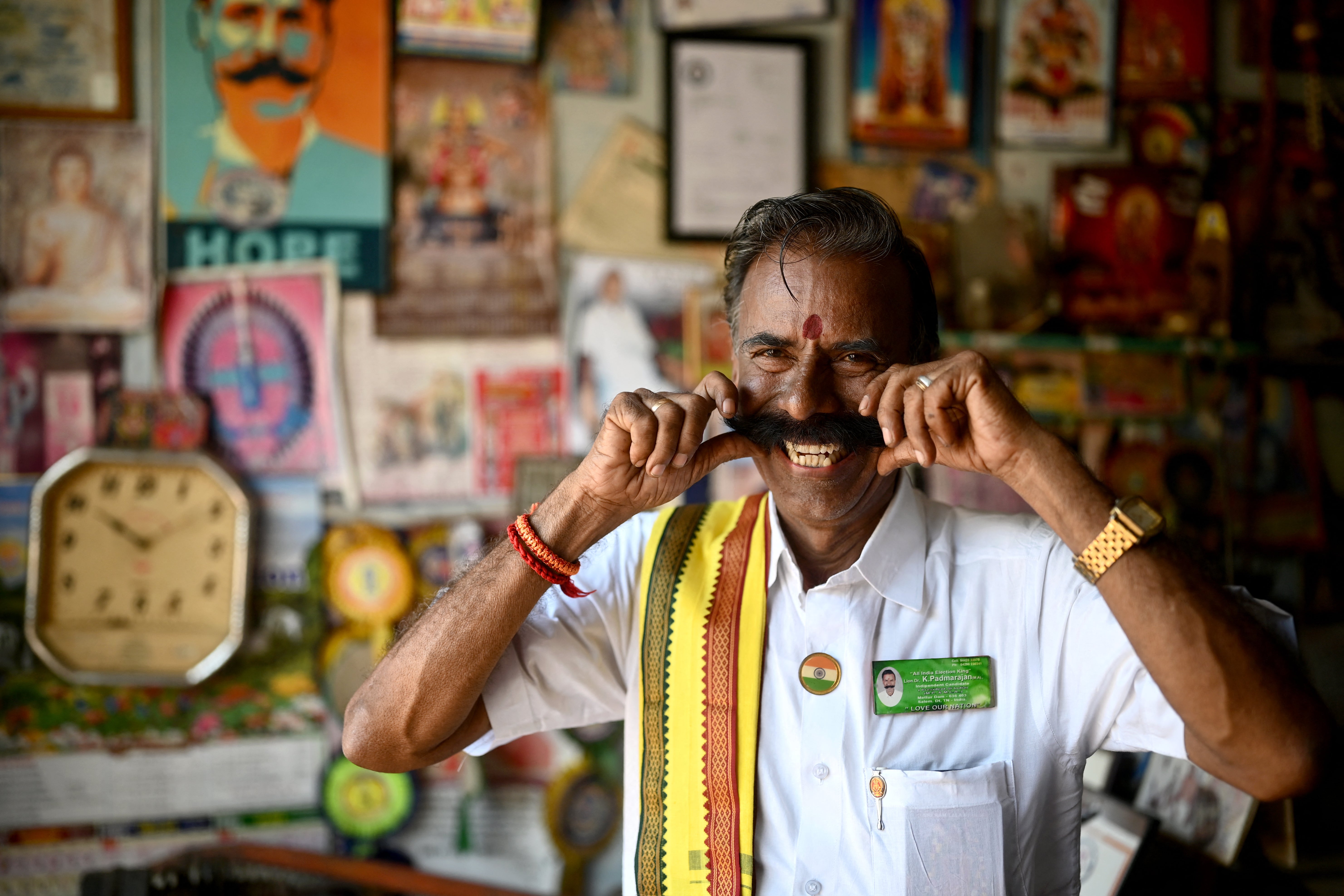 K Padmarajan twirls his moustache while posing for a photograph at his office in Mettur, near Salem district in India’s Tamil Nadu state
