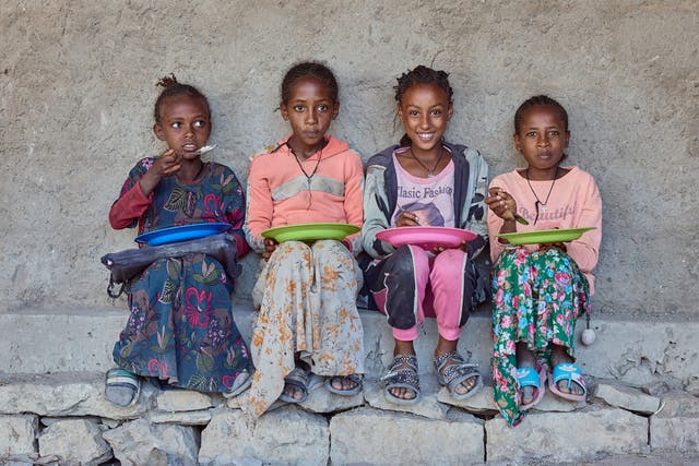 <p>Children eating Mary’s Meals at Beati-Akor Primary School, Tigray, Ethiopia</p>