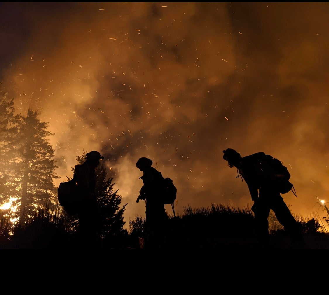 A crew of wildland firefighters tackle a blaze in northern Washington state in 2021. The federal workforce is in crisis due to unliveable wages and poor conditions
