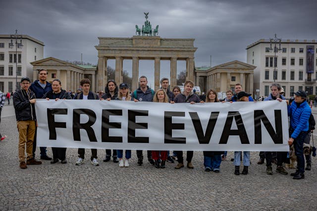 <p>Supporters of Evan Gershkovich gather at Berlin’s Brandenburg Gate, near the Russian embassy, to call for his release on Friday </p>