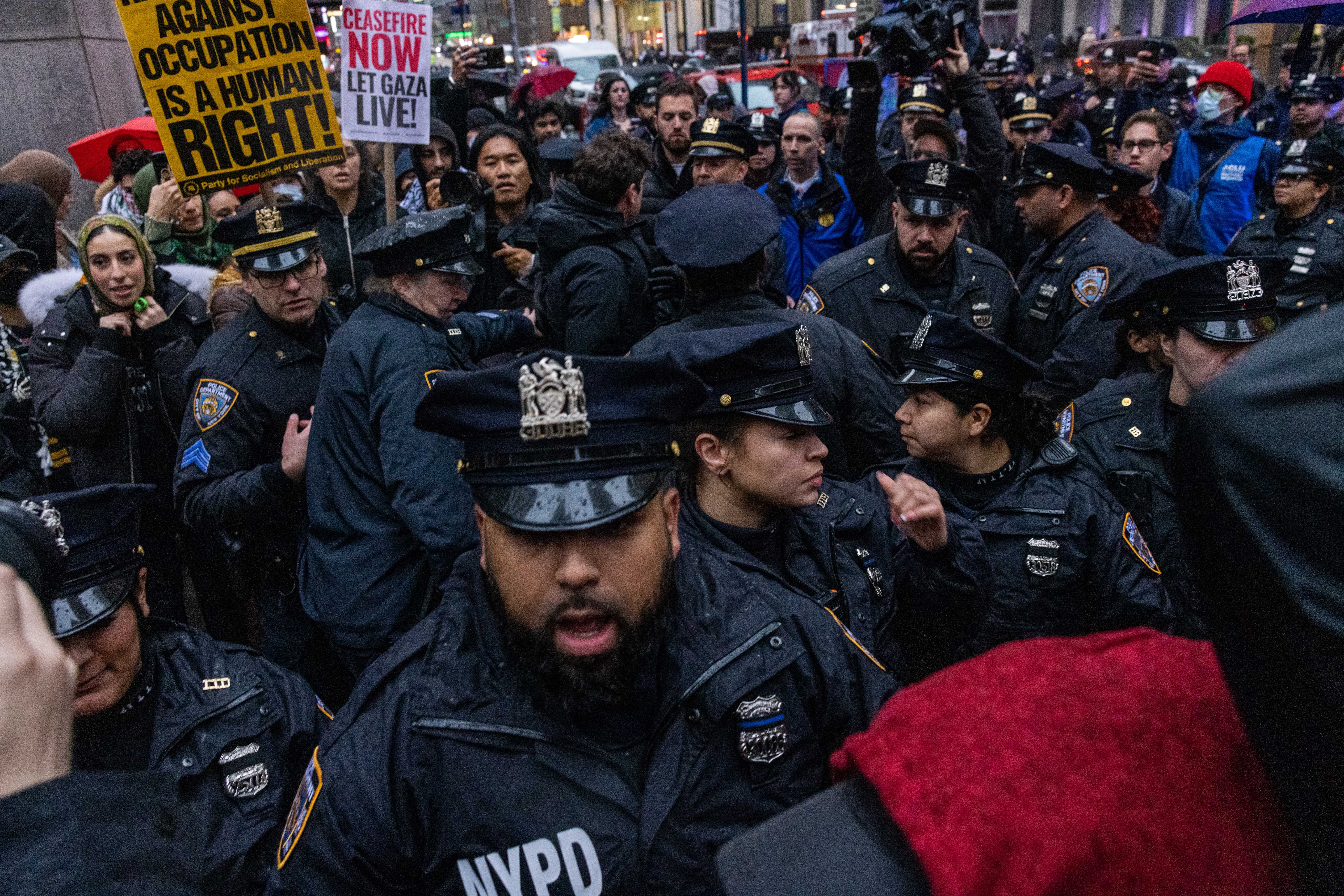NYPD officers confront Pro-Palestinian demonstrators a few blocks from Radio City Music Hall