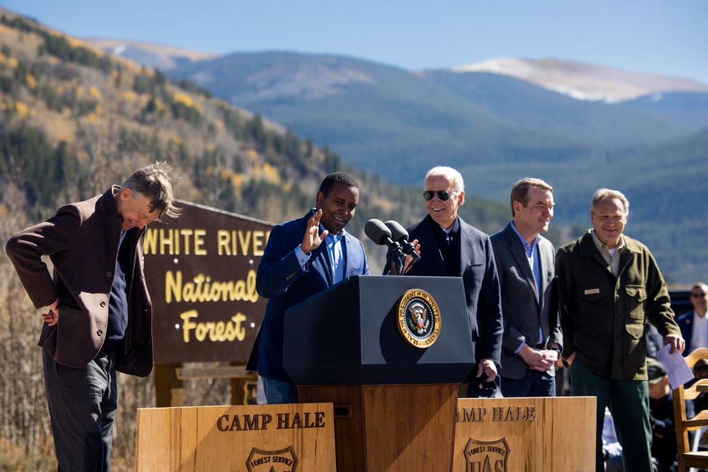Colorado Democrat Joe Neguse with President Biden in Red Cliff, Colorado in 2022. Rep. Neguse has introduced legislation to improve the conditions for federal firefighters in the House