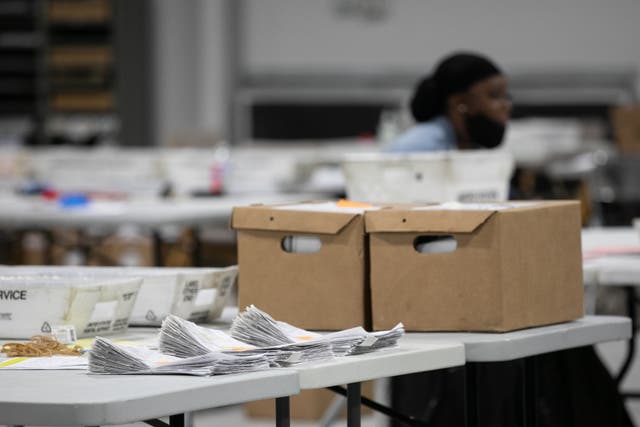 <p>A stack of ballots is in the process of being counted at the Gwinnett Voter Registrations and Elections office on November 6, 2020 in Lawrenceville, Georgia.</p>
