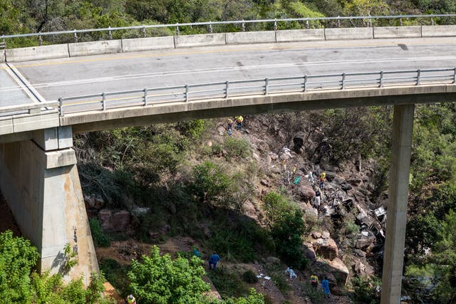 <p>A drone picture shows rescuers working at the site of the bus crash near Mamatlakala in Limpopo province, South Africa</p>