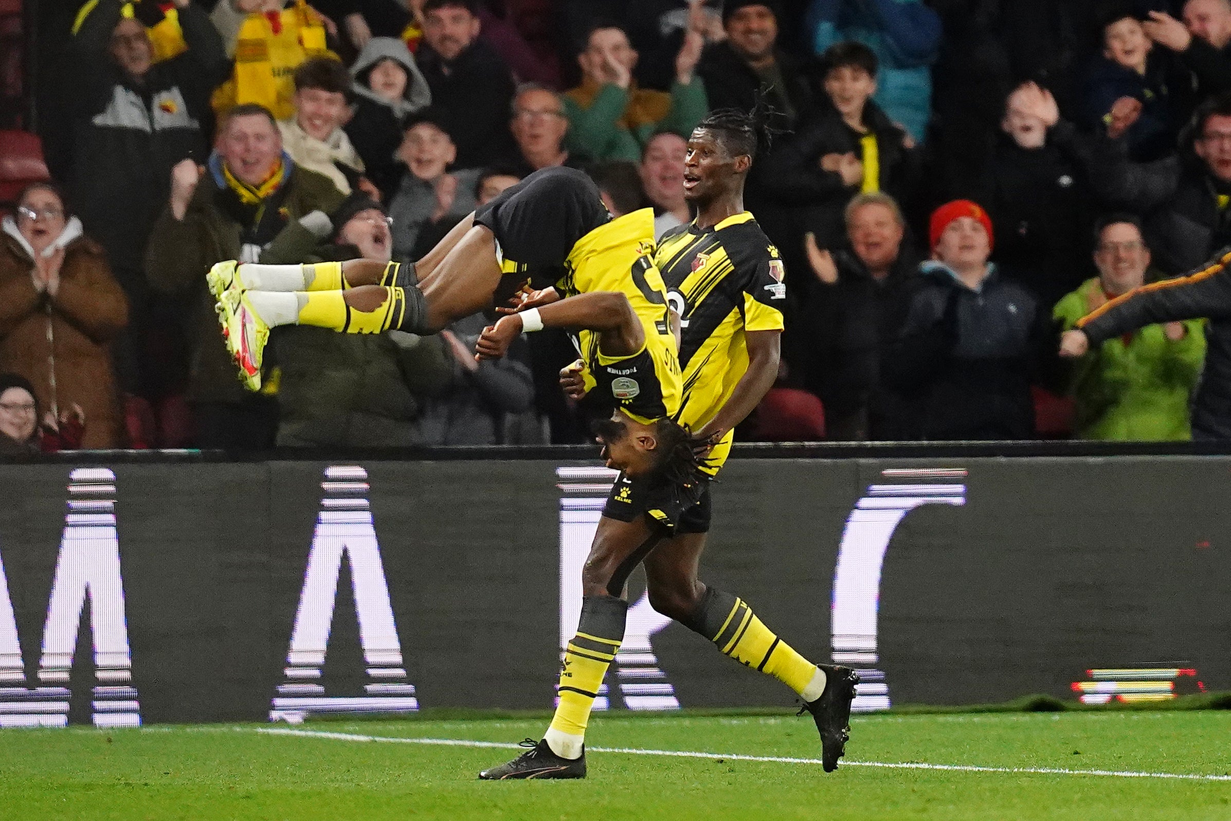 Emmanuel Dennis celebrated restoring Watford’s lead with a backflip