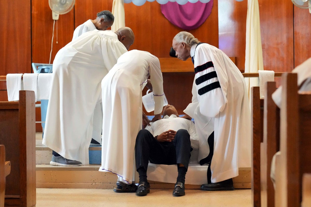 New York City's mayor gets baptized in jail by Rev. Al Sharpton on Good Friday