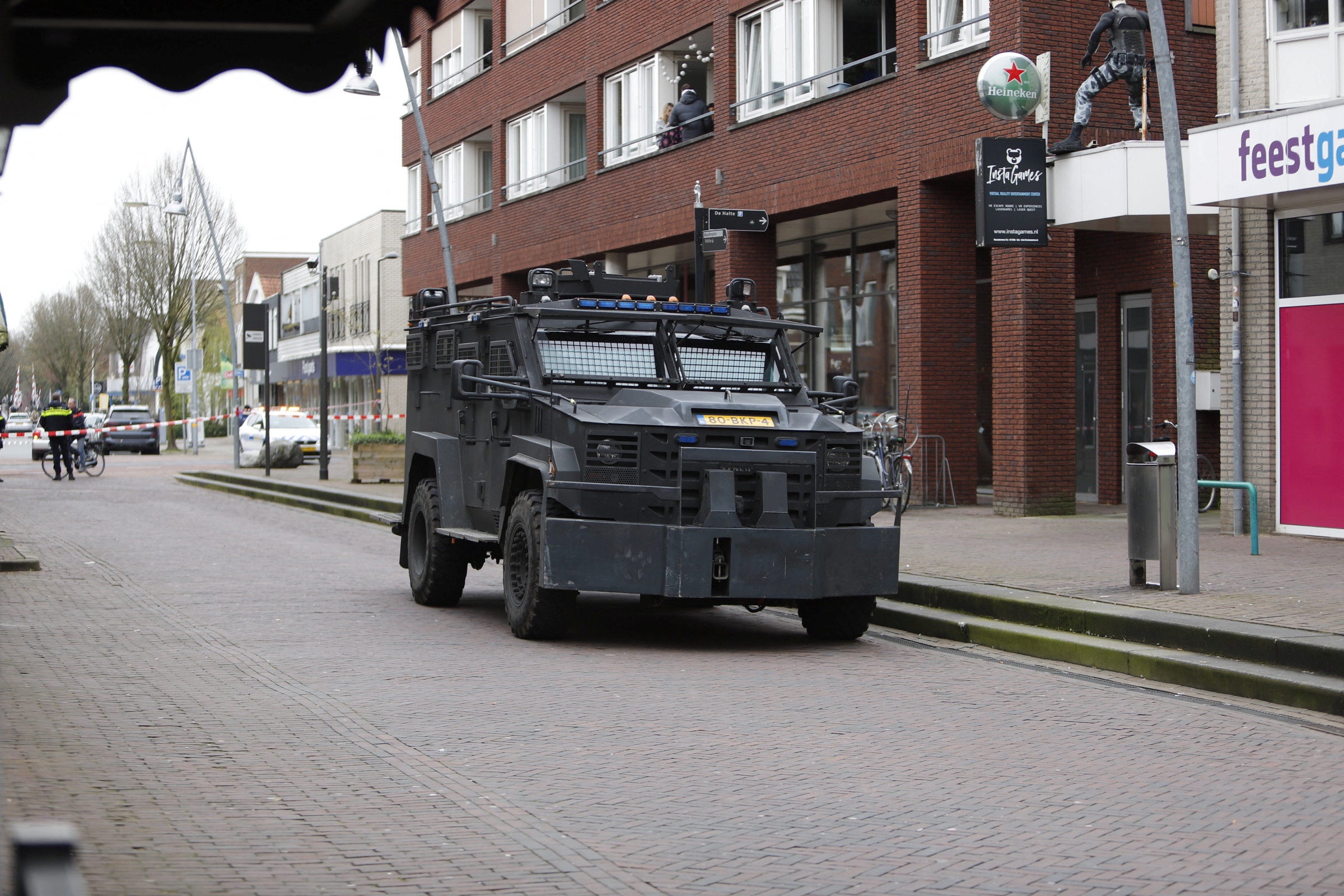 A view shows an armoured vehicle parked on the street near the Cafe Petticoat