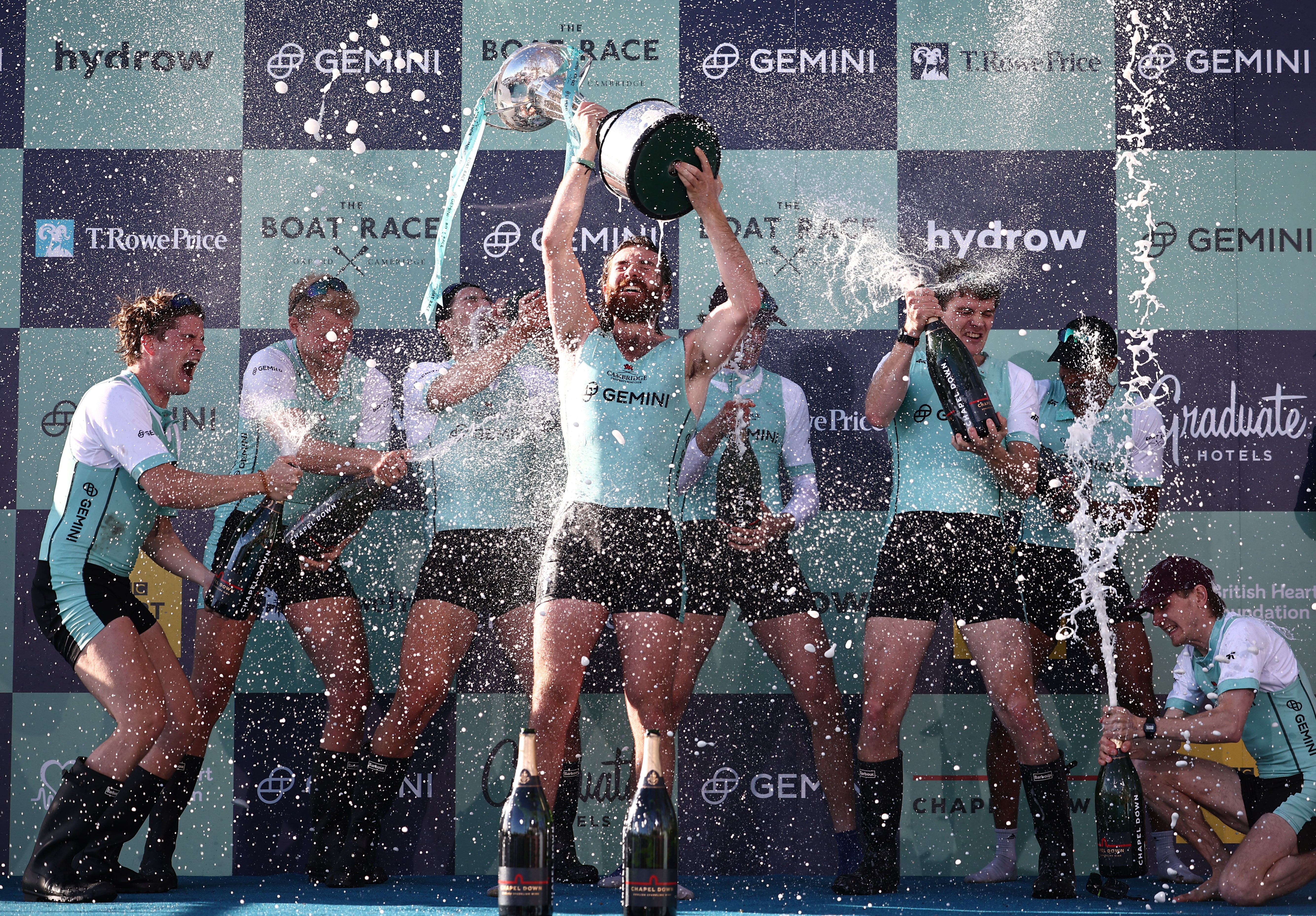 Cambridge University men’s team president Sebastian Benzecry lifts the trophy
