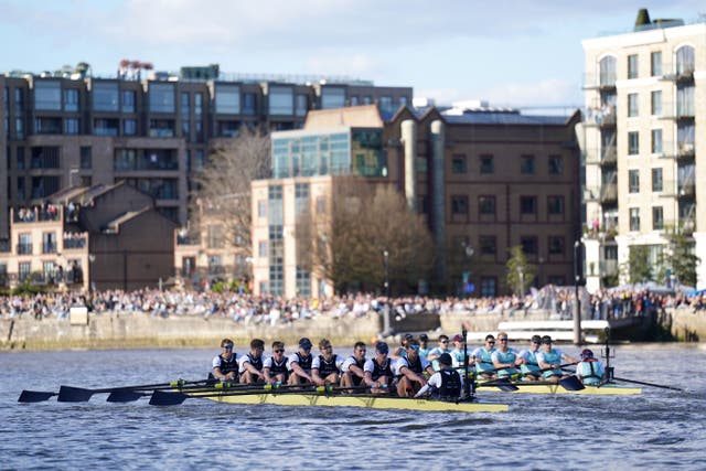 The Oxford and Cambridge teams battle in the Boat Race (Joe Giddens/PA)