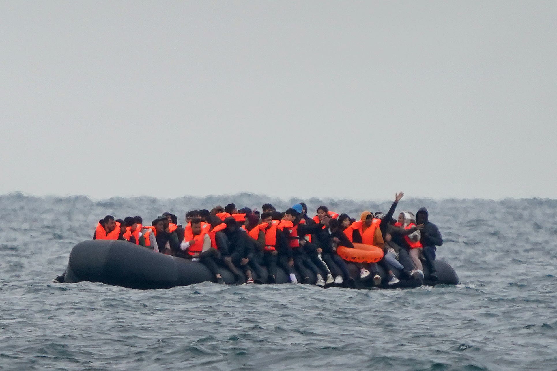 A group of people thought to be migrants crossing the Channel in a small boat traveling from the coast of France and heading in the direction of Dover, Kent (PA)