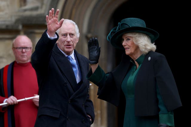 <p>Charles waved to a well-wisher as he and Camilla arrived at St George’s Chapel (Hollie Adams/A)</p>