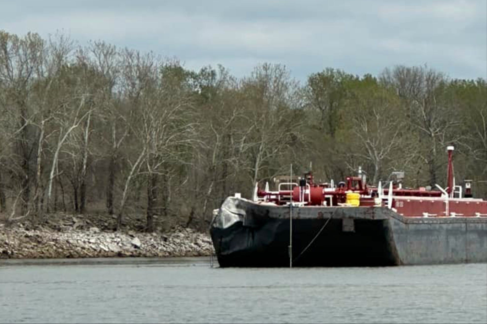 There were no reports of injuries on the highway or the barge, and the cause of the collision remains unknown