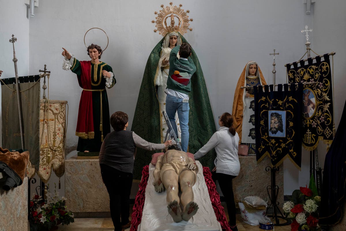 AP PHOTOS: The blessing of rain dampens Holy Week in drought-stricken Spain
