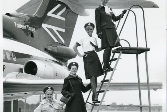 <p>British Airways cabin crew beside a Trident aircraft</p>