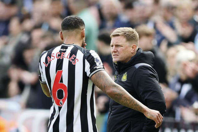 Newcastle defender Jamaal Lascelles is consoled by head coach Eddie Howe after suffering a serious knee injury (Richard Sellers/PA)