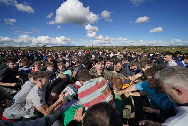 Players from the villages of Hallaton and Medbourne battle for the ‘bottle’ (Joe Giddens/PA)