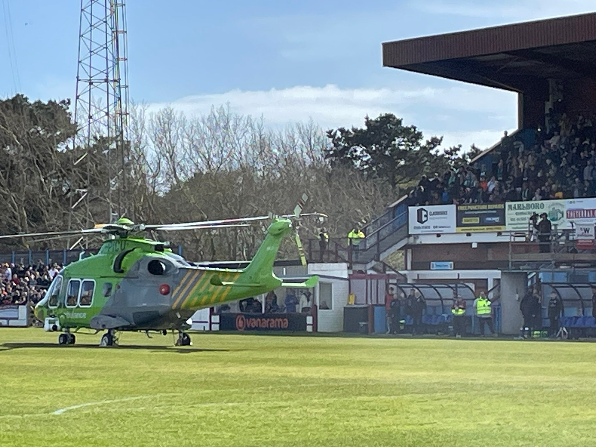 An air ambulance lands on the pitch at the Bob Lucas Stadium
