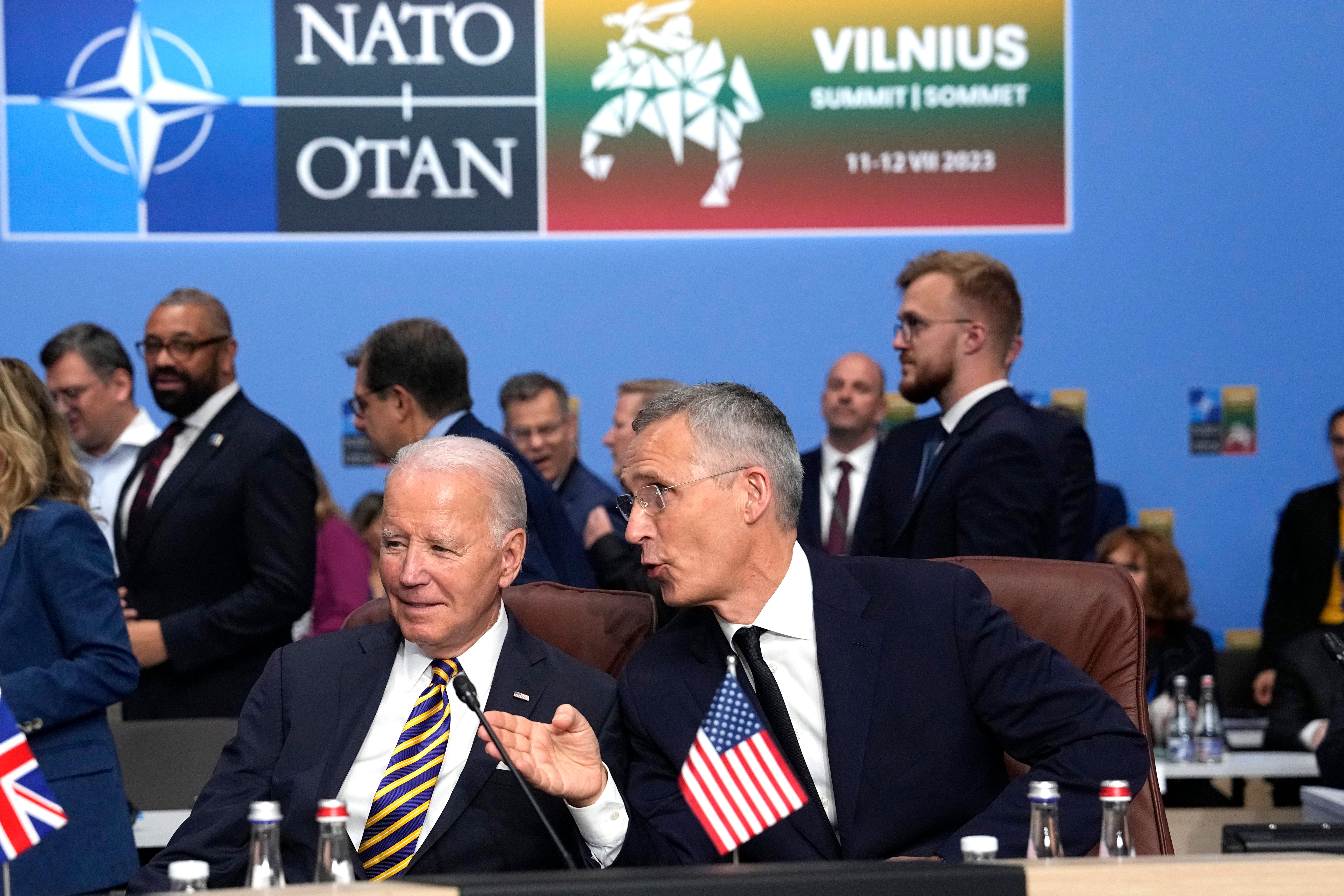 NATO Secretary General Jens Stoltenberg, right, speaks with United States President Joe Biden during a meeting of the NATO-Ukraine Council during a NATO summit in Vilnius, Lithuania, July 12, 2023