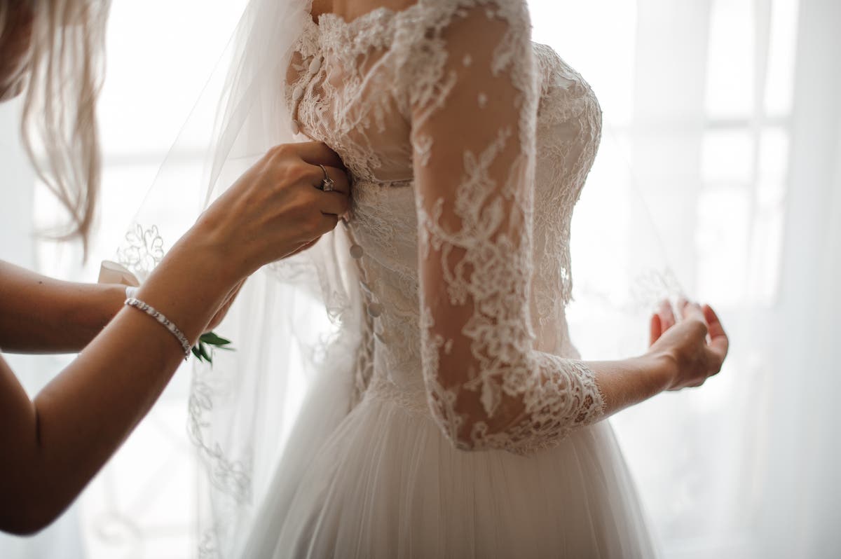 Woman defended after refusing to wear stepsister&rsquo;s handmade wedding dress