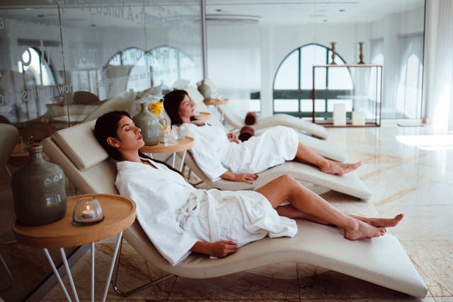 <p>Female friends relaxing together at a wellness retreat.</p>