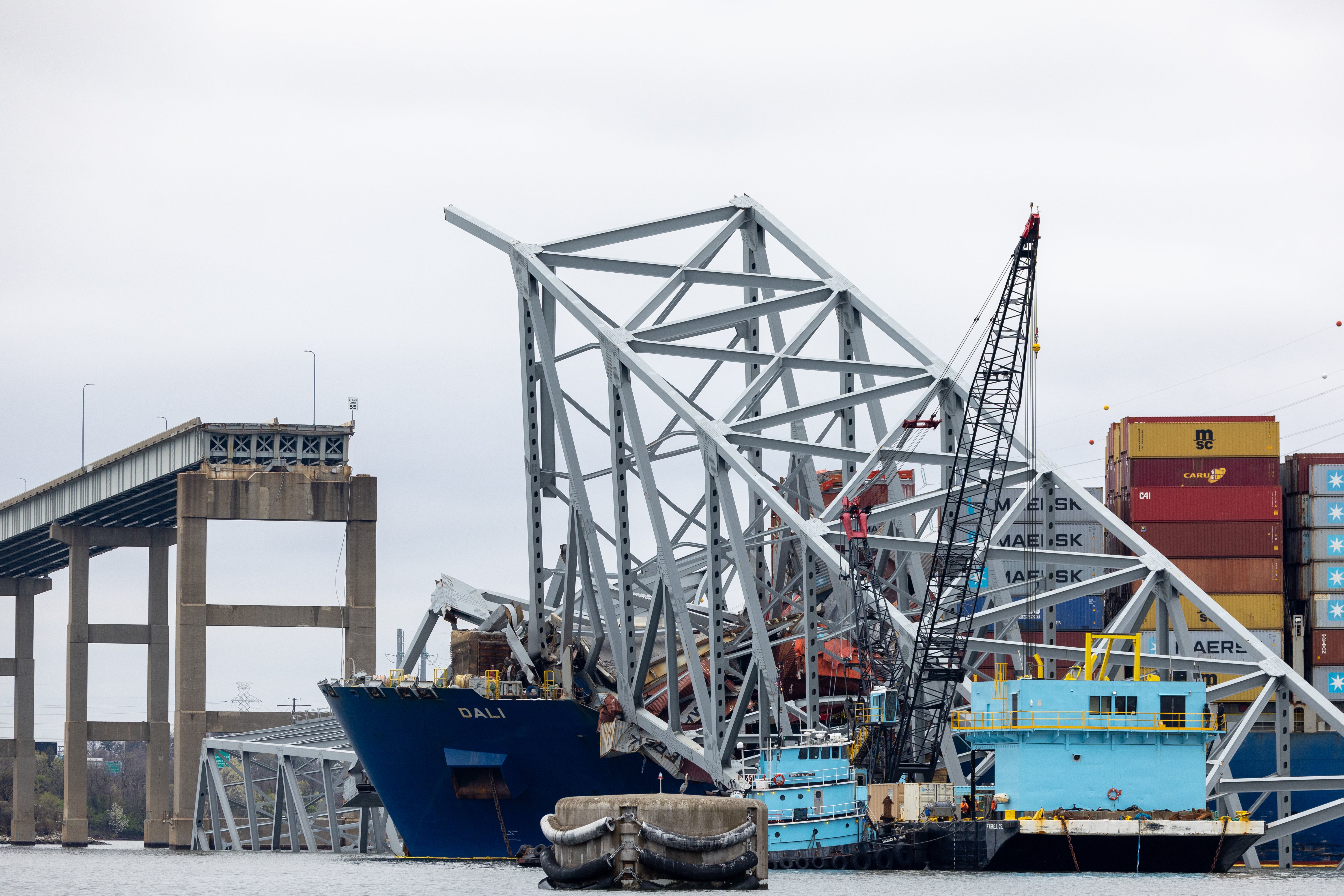 Wreckage from collapsed Francis Scott Key Bridge rests on cargo ship Dali