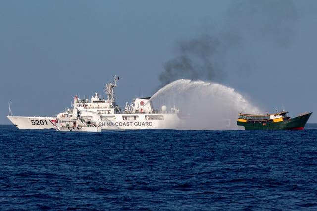 <p>File: Chinese Coast Guard vessels fire water cannons towards Philippine resupply vessel Unaizah on its way to a resupply mission at Second Thomas Shoal in South China Sea</p>