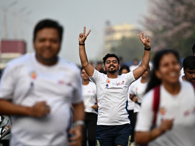 <p>Participants walk down a road during a ‘Vote-A-Thon’ to encourage turnout </p>