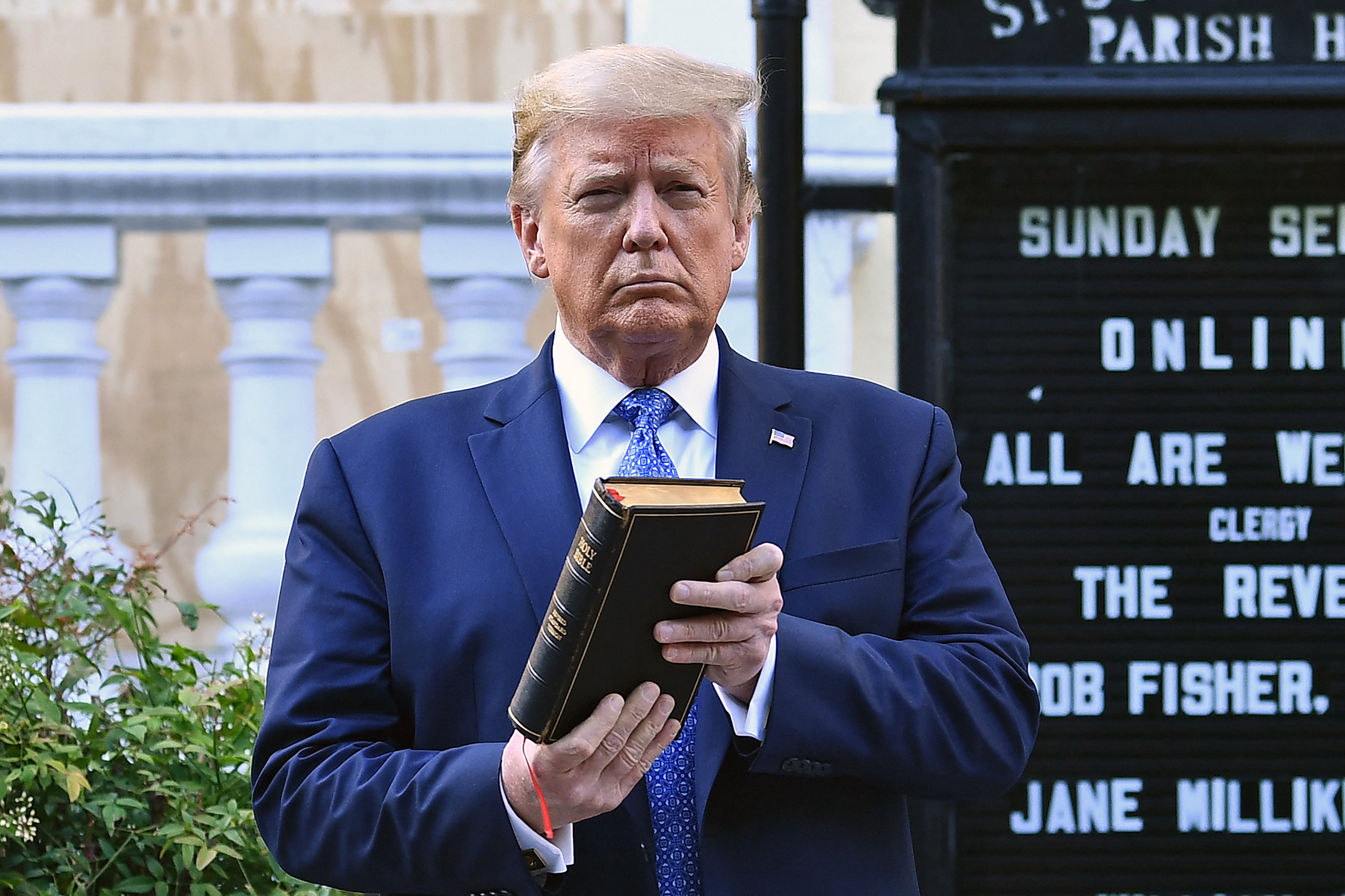 (FILES) US President Donald Trump holds up a Bible outside of St John’s Episcopal church across Lafayette Park