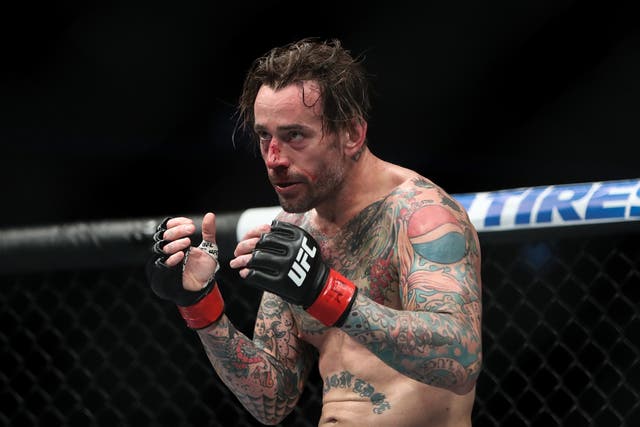 <p>CM Punk during his second of two UFC fights, in 2018</p>