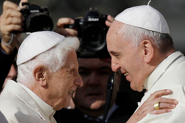<p>Pope Francis, right, hugs Emeritus Pope Benedict XVI</p>