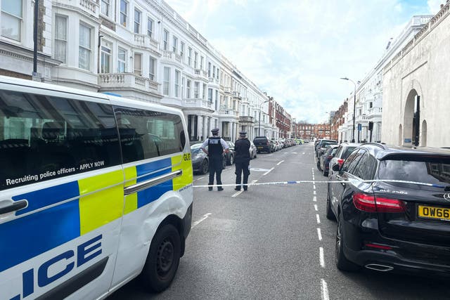 <p>The scene in Comeragh Road, West Kensington, west London, after a man was shot dead on Easter Monday</p>