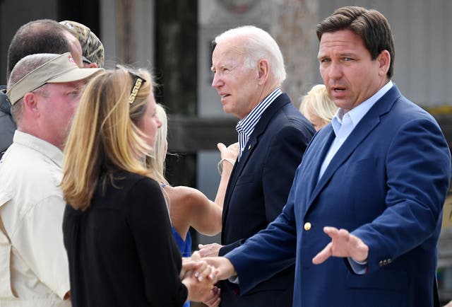 <p>The campaign for US President Joe Biden (C) slammed a six-week abortion ban signed by Florida Governor Ron DeSantis (R)  (Photo by OLIVIER DOULIERY/AFP via Getty Images)</p>