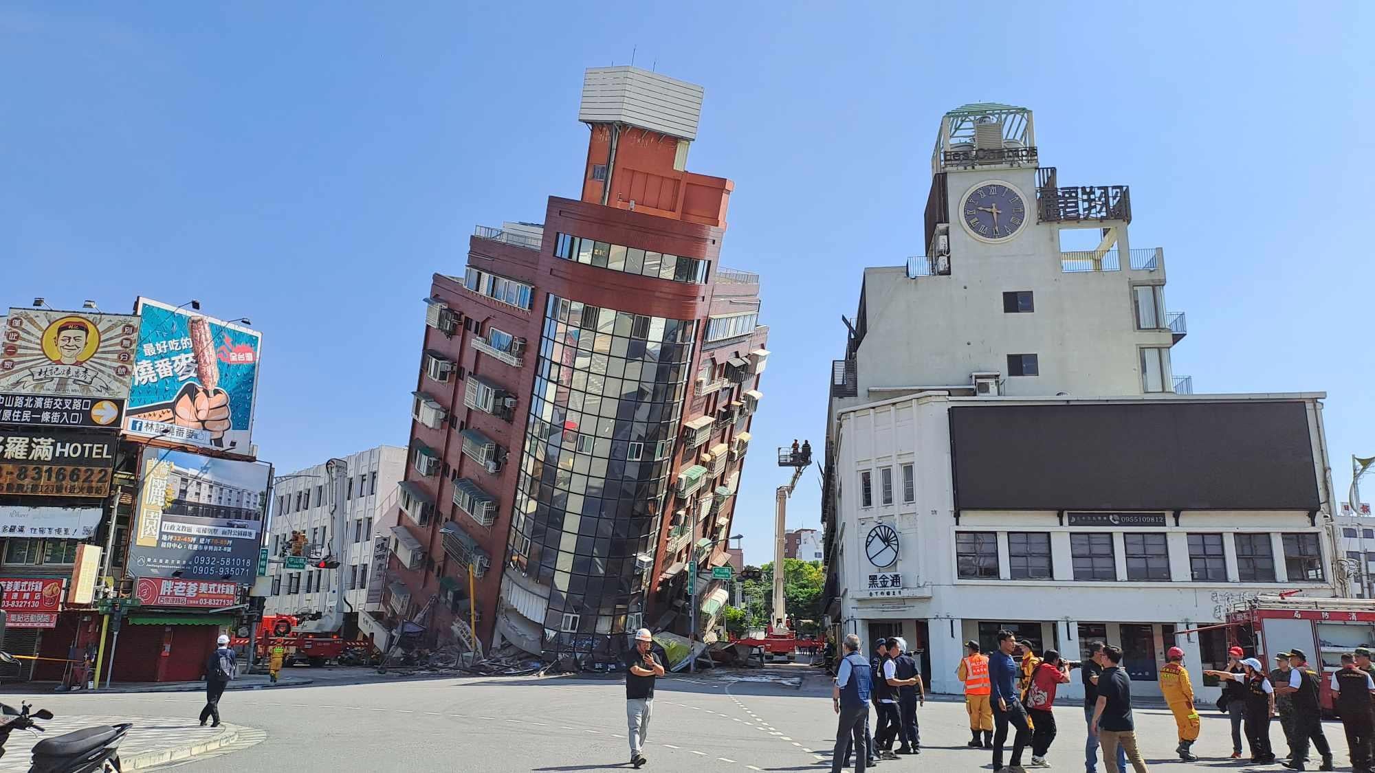 A red building is partially collapsed after a powerful 7.3-magnitude earthquake rocked Taiwan