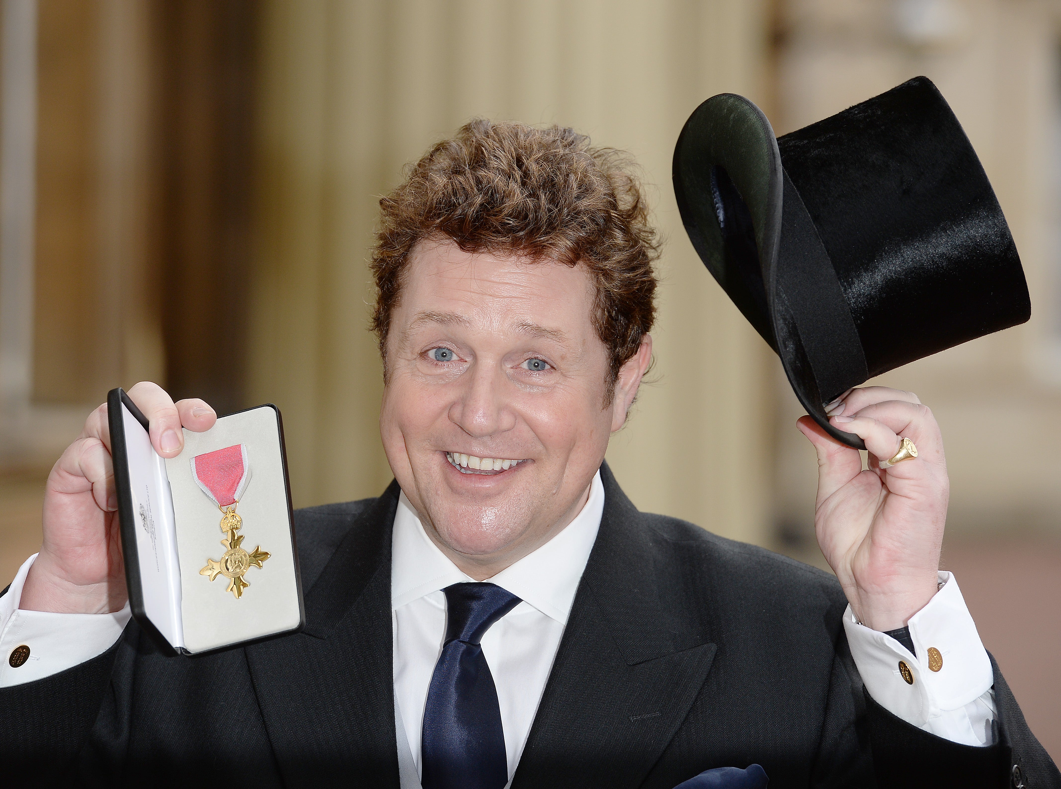 Michael Ball with his OBE after being presented with the honour by the then-Prince Charles at Buckingham Palace, 2016