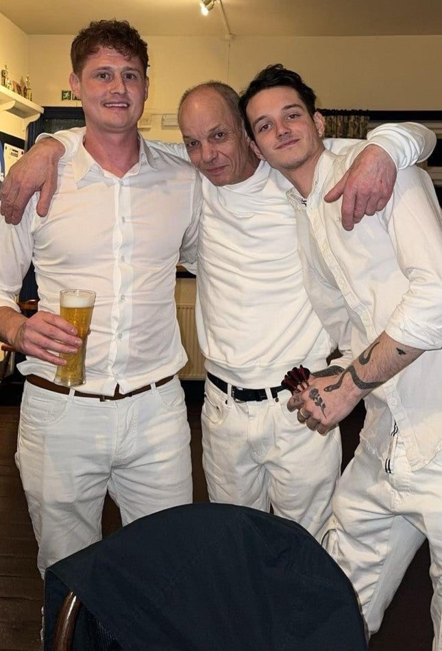 Grandson Connor, 31, Husband Tony, 59 and Grandson Asa, 23, dressed in white in memory of Sharon