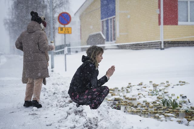 <p>People pay their respects in front of the Viertola School in the Finnish capital Helsinki</p>
