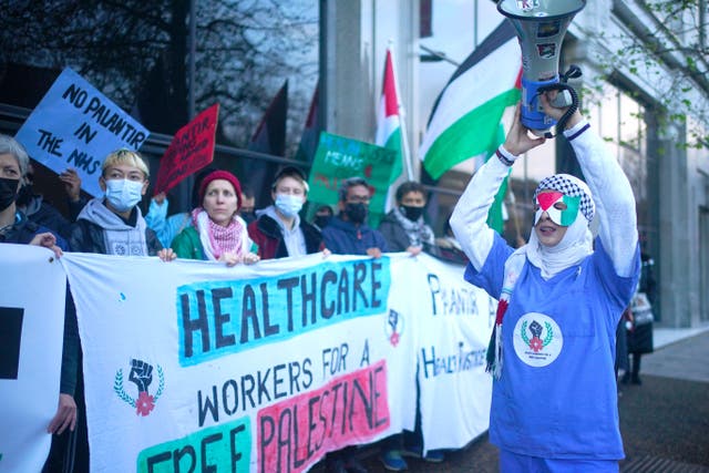 NHS staff blockade the entrance to NHS England’s headquarters in central London (Victoria Jones/PA)