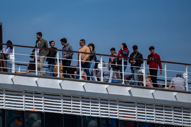 <p>Passengers are photographed on the cruise ship MSC Armony, moored in the port of Barcelona </p>