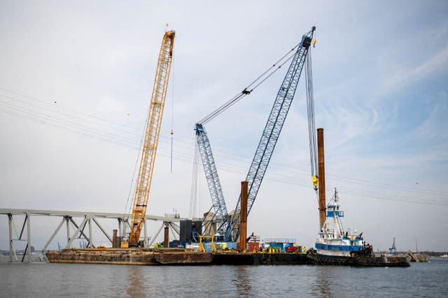 <p>Barge cranes are shown near the collapsed Francis Scott Key Bridge on the Patapsco River, in Baltimore, Maryland, 30 March 30 2024</p>