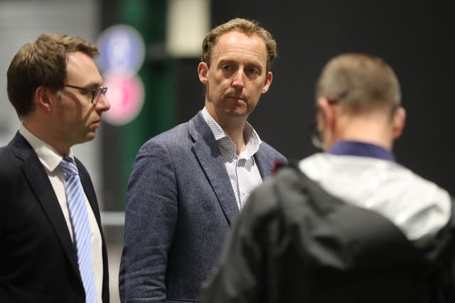 Fianna Fail candidate Barry Andrews (centre) (PA)