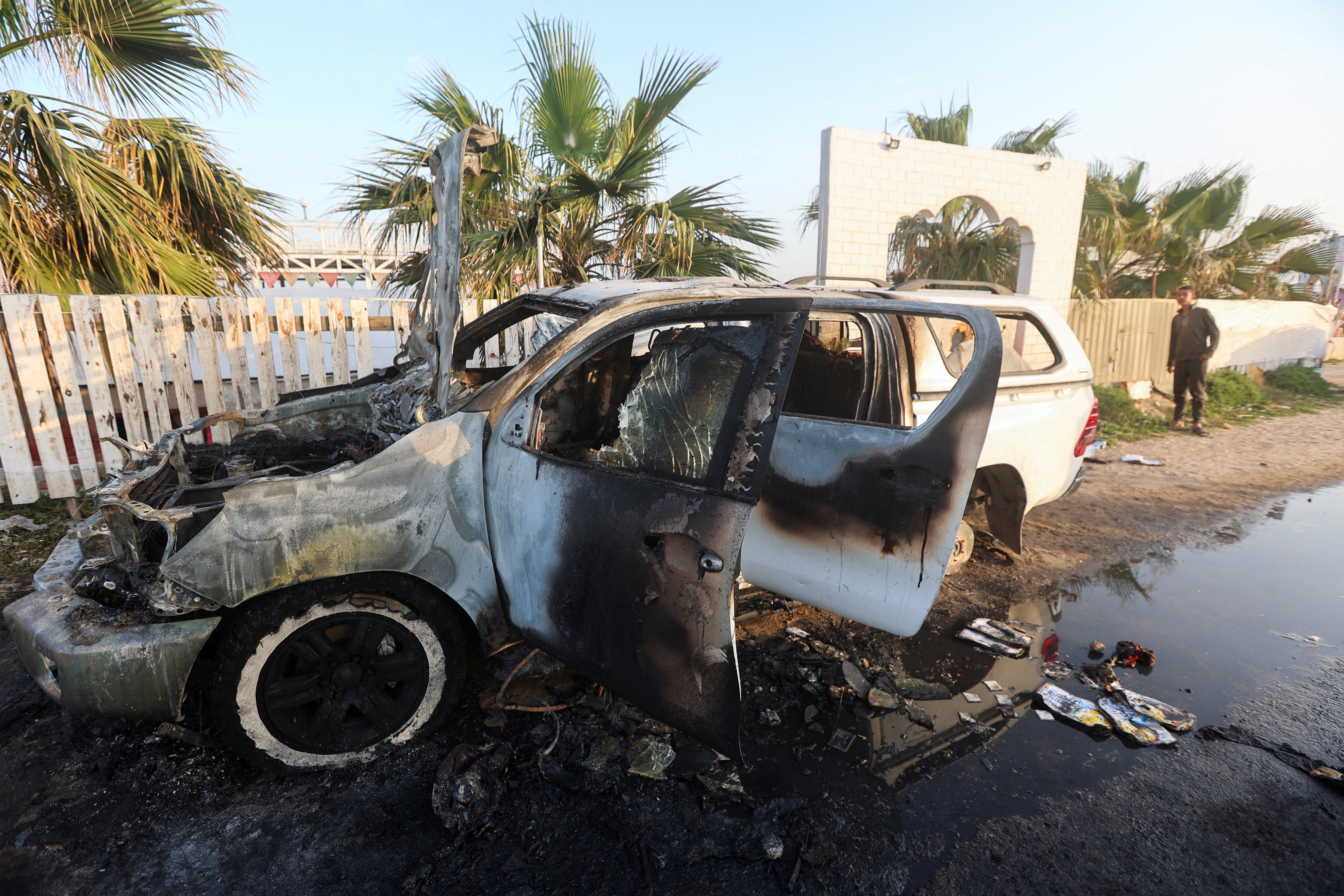 The remains of the vehicle in which employees from World Central Kitchen, including foreigners, were killed in Monday’s Israeli airstrike in Deir al-Balah in the central Gaza Strip