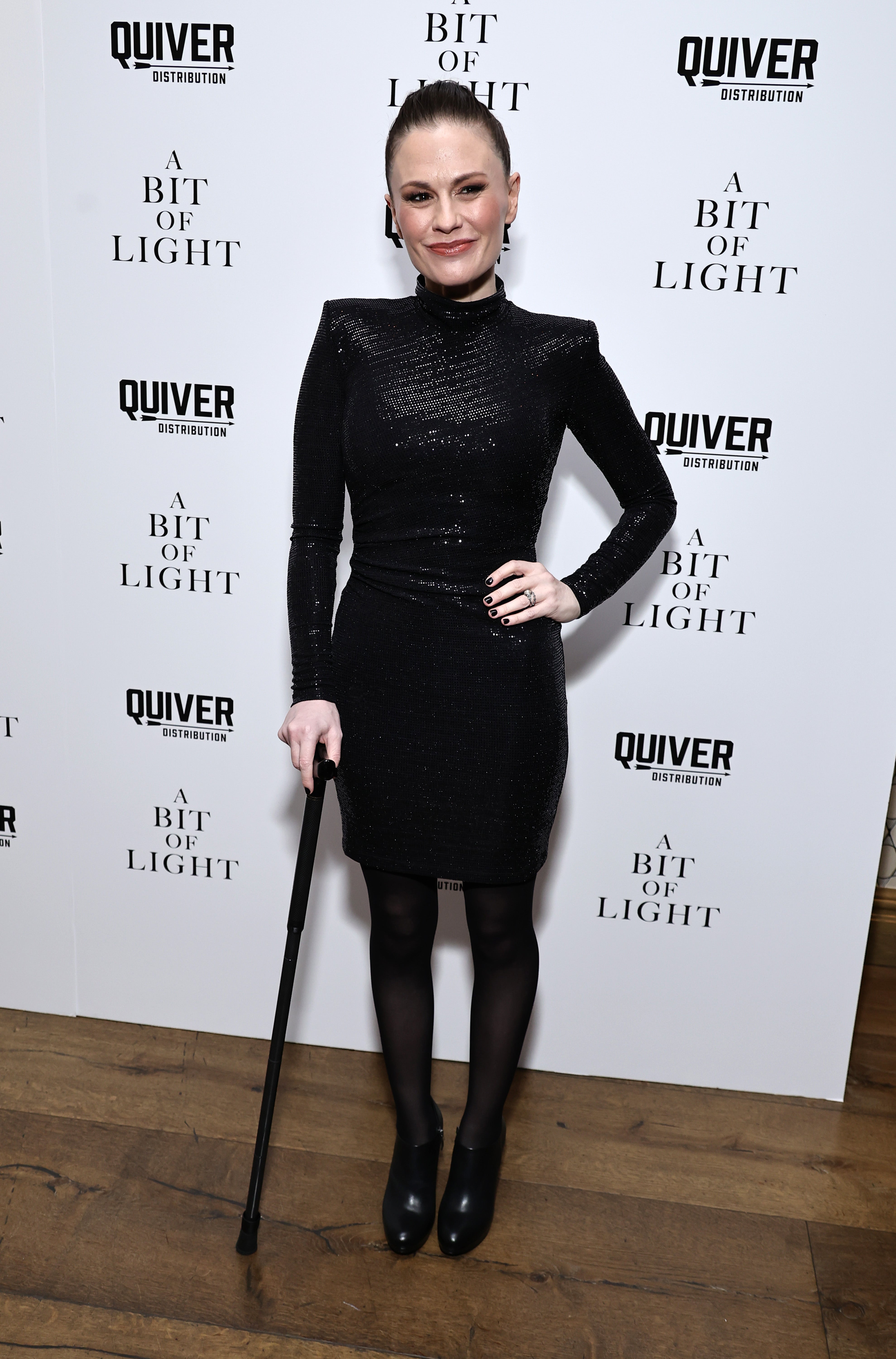 Anna Paquin walks with a cane at premiere of new film
