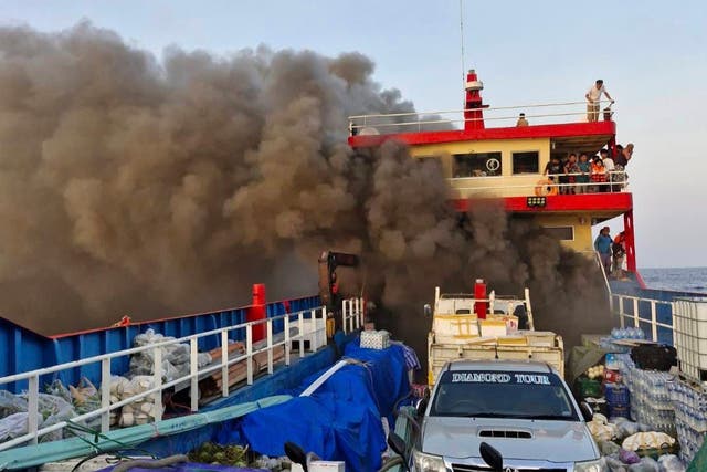 <p>Smoke rises from a ferry in Surat Thani province in Thailand on Thursday 4 April</p>