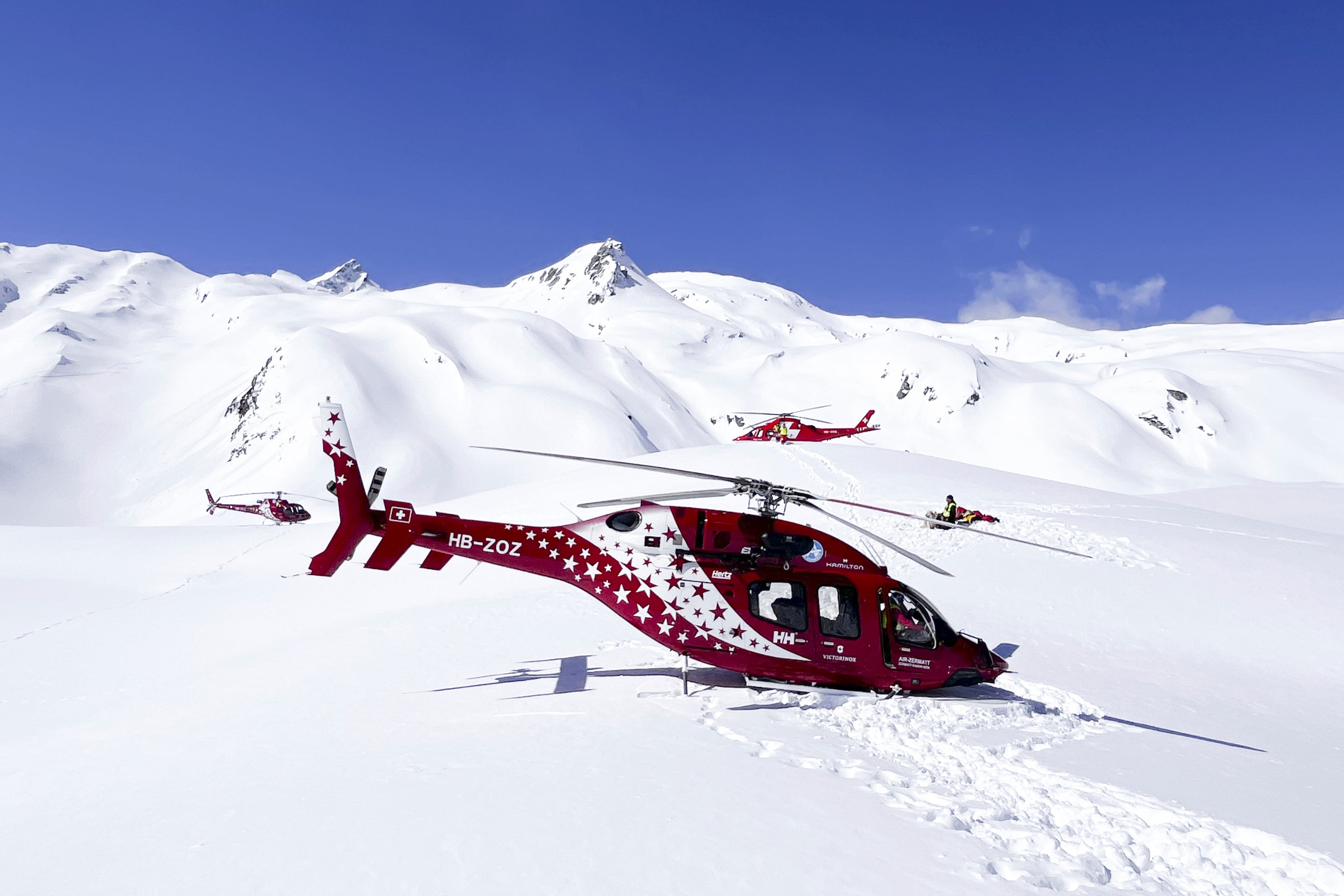 Helicopters in the rescue operation at the Petit Combin mountain in the Swiss Alps