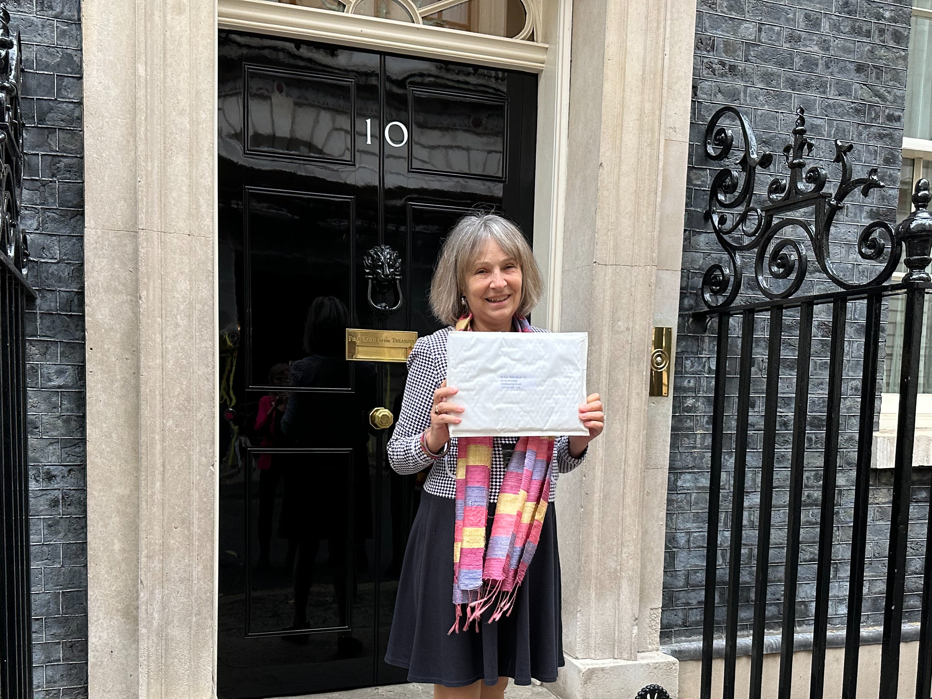 Dr Susan Michaelis delivering a petition to 10 Downing Street
