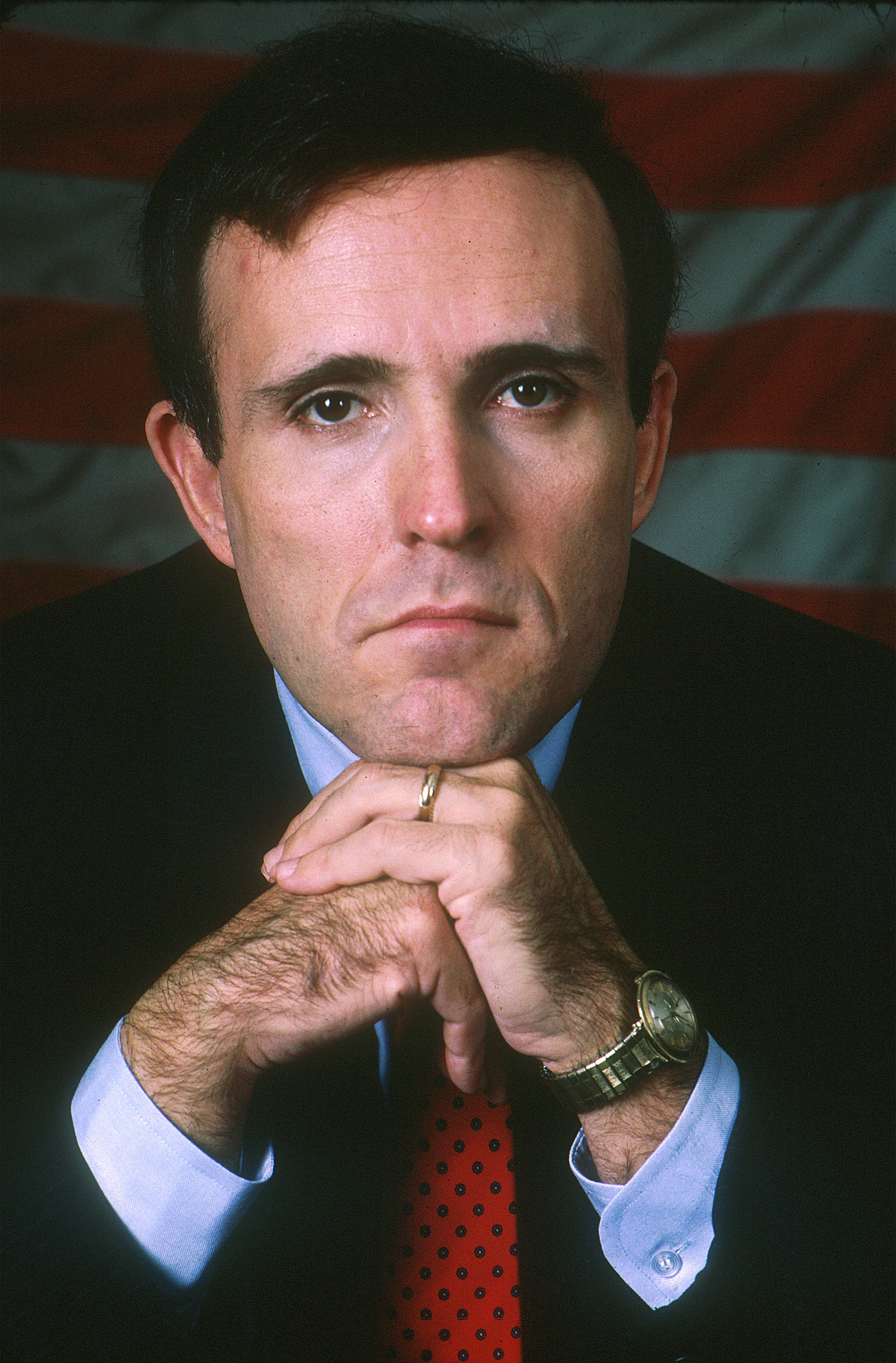 A young Giuliani poses with a watch on his wrist. He now owns dozens of valuable timepieces