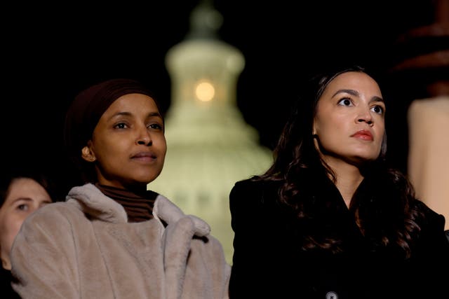 <p>WASHINGTON, DC - NOVEMBER 13: (L-R) U.S. Rep. Ilhan Omar (D-MN) and Alexandria Ocasio-Cortez (D-NY) listen during a news conference calling for a ceasefire in Gaza outside the U.S. Capitol building on November 13, 2023 in Washington, DC. House Democrats held the news conference alongside rabbis with the activist group Jewish Voices for Peace. (Photo by Anna Moneymaker/Getty Images)</p>