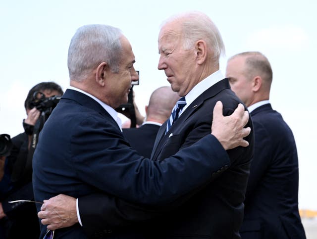 <p>Israel Prime Minister Benjamin Netanyahu greets US President Joe Biden upon his arrival at Tel Aviv's Ben Gurion airport on 18 October 2023</p>